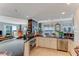 Bright and airy kitchen featuring stainless appliances, granite counters, and dining area with chandelier at 925 N Halifax Ave # 1105, Daytona Beach, FL 32118