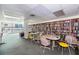 Charming library with extensive bookshelves, reading tables, and bay windows with lovely water views at 925 N Halifax Ave # 1105, Daytona Beach, FL 32118