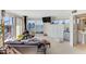 Bright living room boasts a modern fireplace, sleek built-ins, and stunning water views at 925 N Halifax Ave # 1105, Daytona Beach, FL 32118