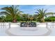 Parking lot with palm trees and view of American Flag, adding to the property's appeal at 925 N Halifax Ave # 1105, Daytona Beach, FL 32118