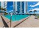 Inviting crystal clear swimming pool is surrounded by comfortable seating and landscaping at 925 N Halifax Ave # 1105, Daytona Beach, FL 32118