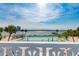 Inviting community pool with waterfront views, surrounded by tropical landscaping and patio seating at 925 N Halifax Ave # 1105, Daytona Beach, FL 32118