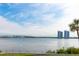 Scenic waterfront view with bridge and high-rise buildings in the distance at 925 N Halifax Ave # 1105, Daytona Beach, FL 32118