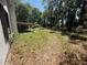 Expansive backyard featuring a covered wooden structure amidst a lush, tree-filled landscape at 230 Katrina St # 230, De Leon Springs, FL 32130