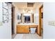 Bathroom featuring a wood vanity with a wide mirror and separate shower at 230 Katrina St # 230, De Leon Springs, FL 32130