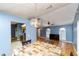 Dining room showing an open floor plan that connects with the kitchen and living area at 230 Katrina St # 230, De Leon Springs, FL 32130