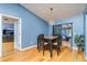 Dining area featuring a modern chandelier, table set, and sliding door at 230 Katrina St # 230, De Leon Springs, FL 32130
