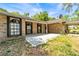 The front of the house is brick with a paved patio at 230 Katrina St # 230, De Leon Springs, FL 32130