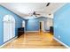 Living room with wood floors and view to the dining room at 230 Katrina St # 230, De Leon Springs, FL 32130