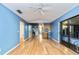 Open-concept living area with wood floors connecting to the kitchen at 230 Katrina St # 230, De Leon Springs, FL 32130