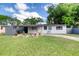 Charming single-story home featuring a well-manicured lawn, updated exterior paint, and a covered entry way at 220 Woodmere Blvd, Sanford, FL 32773