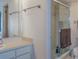 Bathroom featuring a vanity, a glass enclosed shower and tile flooring at 1 Tomoka Oaks Blvd # 102, Ormond Beach, FL 32174