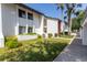 Beautifully maintained condo featuring lush landscaping and a well-manicured lawn at 1 Tomoka Oaks Blvd # 102, Ormond Beach, FL 32174