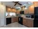 Functional kitchen with ample cabinet space, modern appliances, and a tile backsplash at 1 Tomoka Oaks Blvd # 102, Ormond Beach, FL 32174