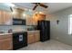 Functional kitchen with ample cabinet space, modern appliances, and a tile backsplash at 1 Tomoka Oaks Blvd # 102, Ormond Beach, FL 32174