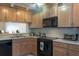 Functional kitchen with ample cabinet space, modern appliances, and a tile backsplash at 1 Tomoka Oaks Blvd # 102, Ormond Beach, FL 32174