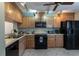 Functional kitchen with ample cabinet space, modern appliances, and a tile backsplash at 1 Tomoka Oaks Blvd # 102, Ormond Beach, FL 32174