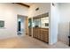 Entertaining space with wet bar, mirrored backsplash and wooden cabinets at 1 Tomoka Oaks Blvd # 102, Ormond Beach, FL 32174