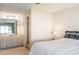Bright main bedroom featuring an ensuite bathroom with a vanity with a large mirror at 1 Tomoka Oaks Blvd # 102, Ormond Beach, FL 32174