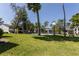 A community pool with grassy common areas can be seen from many of the condos at 1 Tomoka Oaks Blvd # 102, Ormond Beach, FL 32174