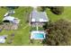 A beautiful aerial view of a home with a swimming pool, well-maintained lawn and lots of open space at 1060 Still Rd, Pierson, FL 32180