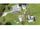 Aerial view of a house, pool, outbuildings, and surrounding acreage at 1060 Still Rd, Pierson, FL 32180