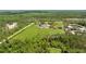 Vast acreage with lush greenery, scattered residences, and road frontage at 1060 Still Rd, Pierson, FL 32180
