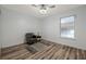 Neutral bedroom with a patterned rug, chair and a window at 1060 Still Rd, Pierson, FL 32180