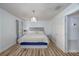 Simple bedroom with hardwood floors and a soft bed at 1060 Still Rd, Pierson, FL 32180