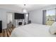 Comfortable bedroom with a fireplace and large window at 1060 Still Rd, Pierson, FL 32180