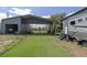 Outdoor space with a metal carport, green artificial grass, and a parked RV at 1060 Still Rd, Pierson, FL 32180