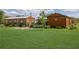 Large grass backyard with two buildings, trees and garden area at 1060 Still Rd, Pierson, FL 32180