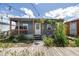 Charming house with a wooden porch, featuring string lights and lush green landscaping at 1060 Still Rd, Pierson, FL 32180