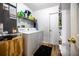 Functional laundry room with washer, dryer, and storage shelves at 1060 Still Rd, Pierson, FL 32180