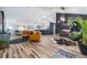 Open-concept living room featuring hardwood floors and access to dining and kitchen at 1060 Still Rd, Pierson, FL 32180