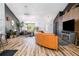 Spacious living room with high ceilings and modern decor with view into the kitchen at 1060 Still Rd, Pierson, FL 32180