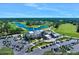 Aerial view of golf course with clubhouse and parking lot at 1128 Hansberry Ct, Ormond Beach, FL 32174