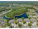 A sprawling residential community with lakes and trees, viewed from above at 1128 Hansberry Ct, Ormond Beach, FL 32174