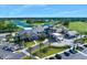 Aerial view of golf club featuring clubhouse, golf course and parking at 1128 Hansberry Ct, Ormond Beach, FL 32174