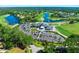 An aerial panorama of the community highlights its golf course, clubhouse, lakes, and lush landscaping at 1128 Hansberry Ct, Ormond Beach, FL 32174