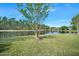 Picturesque backyard with a tranquil pond view, enhancing the property's natural beauty at 1128 Hansberry Ct, Ormond Beach, FL 32174