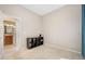 Cozy bedroom with neutral walls, tile flooring, and an ensuite bathroom at 1128 Hansberry Ct, Ormond Beach, FL 32174