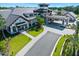 Welcoming entrance to the clubhouse featuring well-kept landscaping, covered drop-off area, and a tower at 1128 Hansberry Ct, Ormond Beach, FL 32174