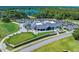 Stunning aerial view of the expansive clubhouse overlooking the golf course and meticulously manicured grounds at 1128 Hansberry Ct, Ormond Beach, FL 32174