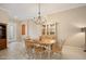 Bright dining room featuring a stylish chandelier and neutral decor at 1128 Hansberry Ct, Ormond Beach, FL 32174