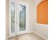 Elegant foyer with decorative glass front door and sidelight at 1128 Hansberry Ct, Ormond Beach, FL 32174