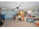 Spacious garage featuring ample storage, a work area, and an automatic garage door opener at 1128 Hansberry Ct, Ormond Beach, FL 32174