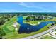 Scenic aerial view of the golf course with lush greenery, water features and meticulously manicured fairways at 1128 Hansberry Ct, Ormond Beach, FL 32174