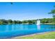 Beautiful tranquil lake with a fountain as the focal point at 1128 Hansberry Ct, Ormond Beach, FL 32174