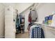 Walk-in closet with metal racks and shelves provides organized storage solutions at 1128 Hansberry Ct, Ormond Beach, FL 32174
